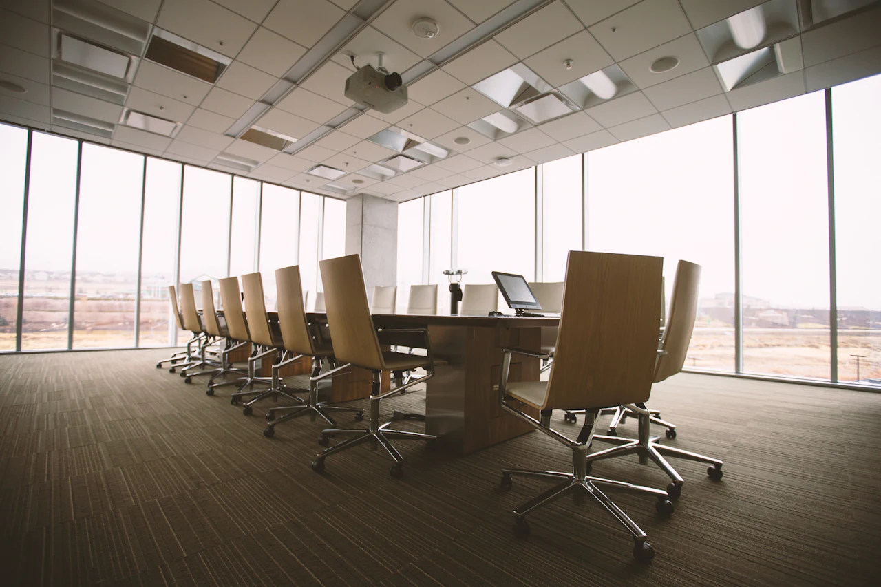 Conference room with a long table and large windows (illustrative)