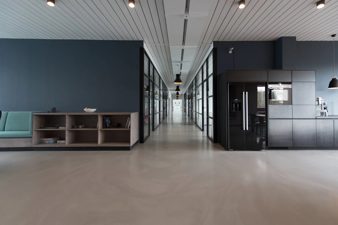 Glass-partitioned office corridor (illustrative)