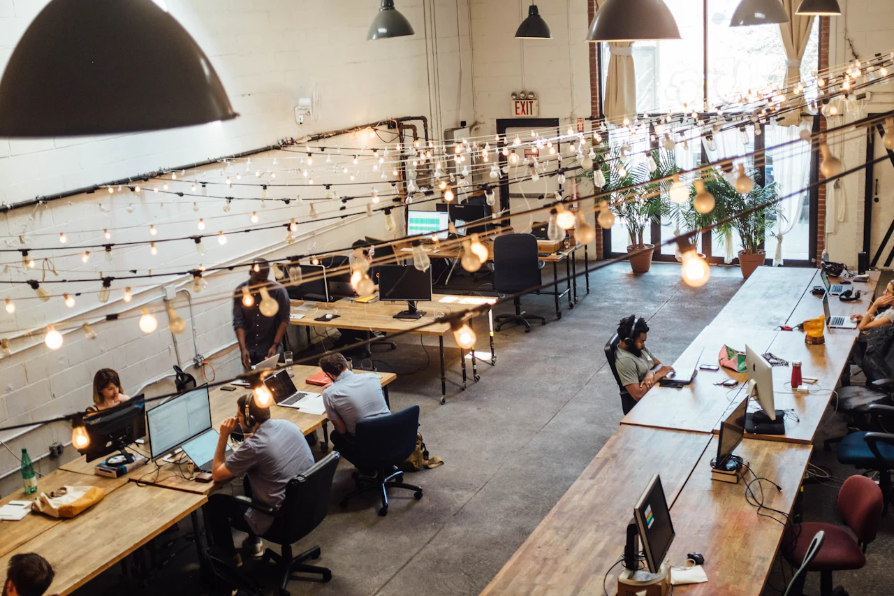 Open coworking floor with shared desks (illustrative)